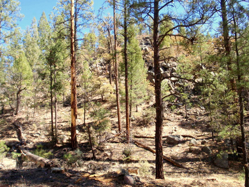 We are slowly slipping into a rugged boulder lined valley.